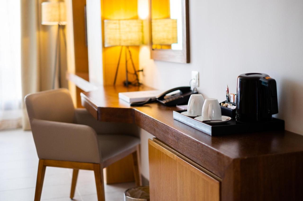 Les Orangers Garden Villas And Bungalows Ultra All Inclusive Hammamet Exterior foto A Nespresso machine in a hotel room